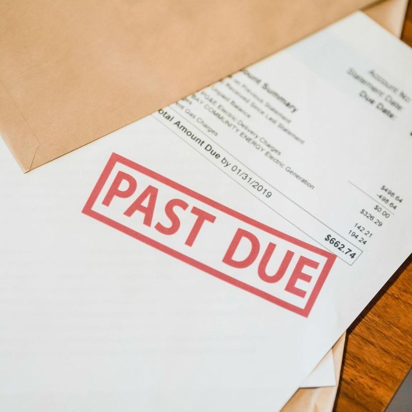 An envelope and a printed invoice stamped as 