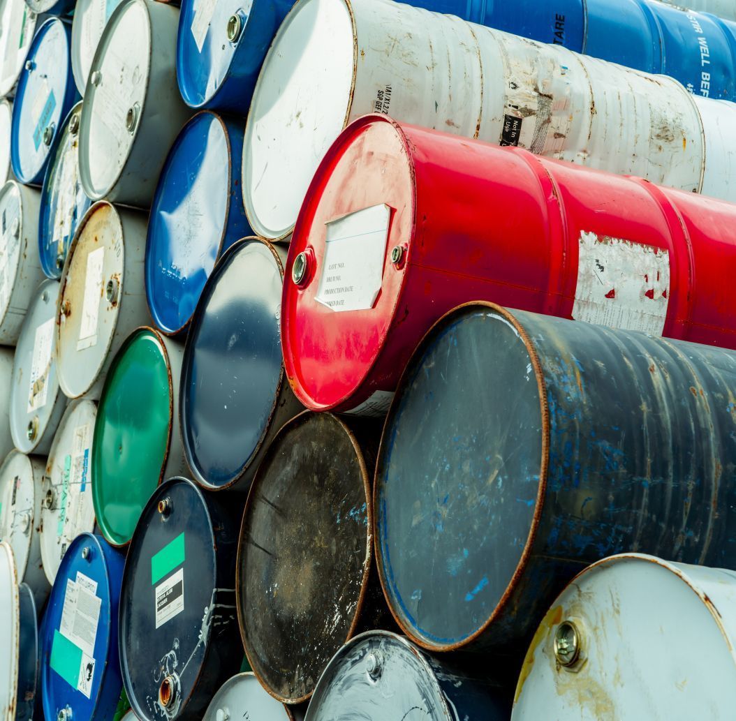 A bunch of barrels are stacked on top of each other