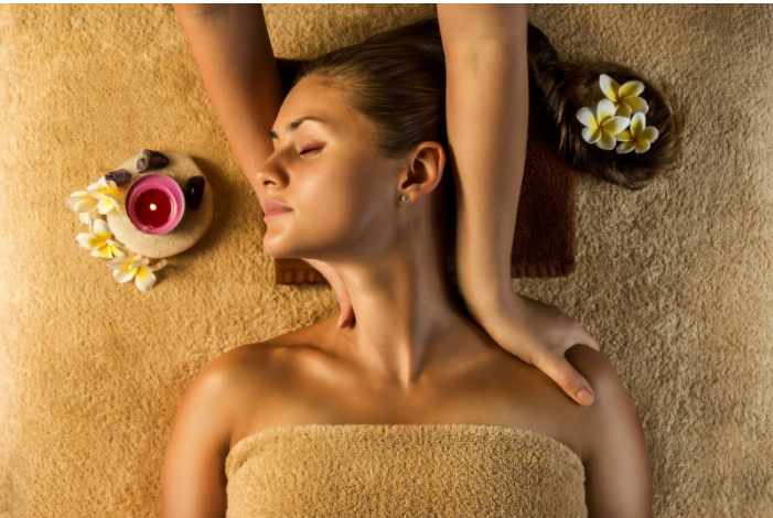 A woman is getting a massage at a spa.