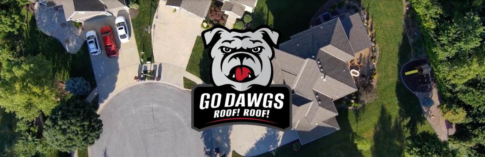 An aerial view of a house with a bulldog logo on the side of it.