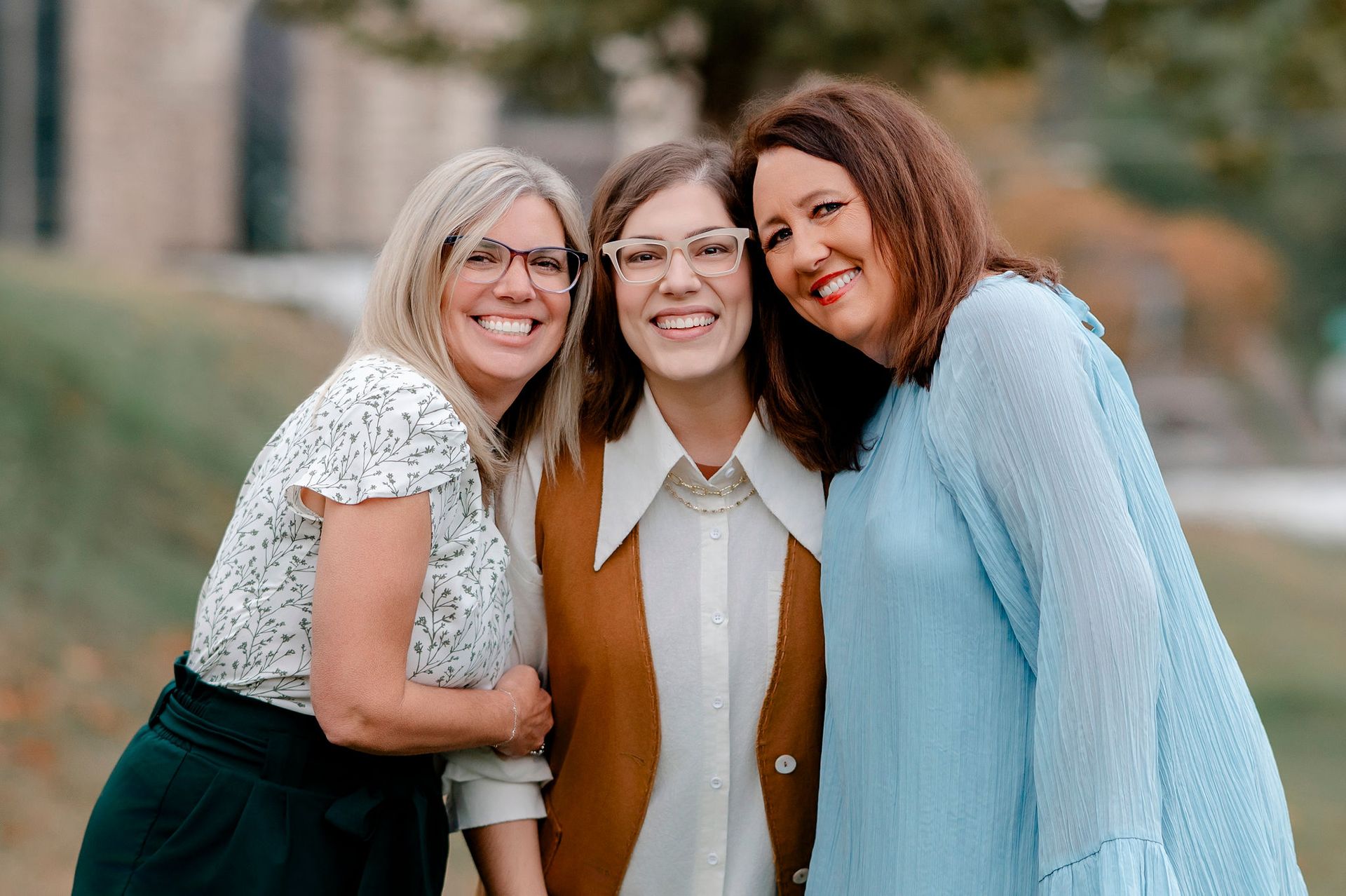 Close-up of a smiling mouth with bright white teeth and soft pink lipstick.