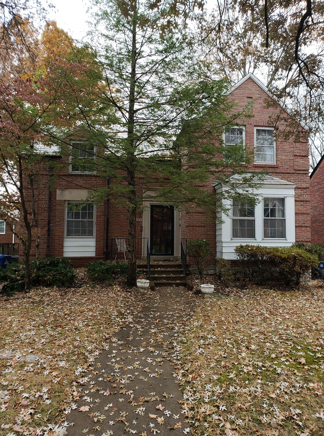 Front View Of Brick House With Trees — St. Louis, MO — Mirelli Tuckpointing LLC