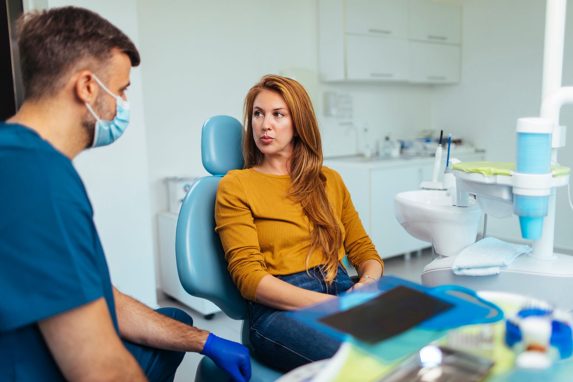 Patient in a consultation for All on Four Dental Implants in St John, IN Patient in a consultation for All on Four Dental Implants in St John, IN