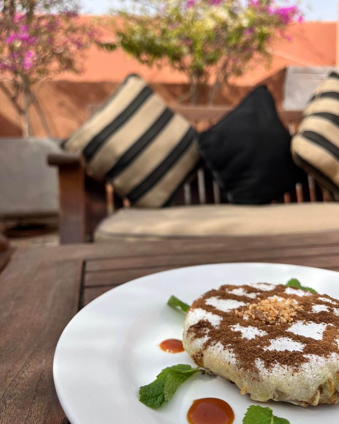 A plate of food with a couch in the background
