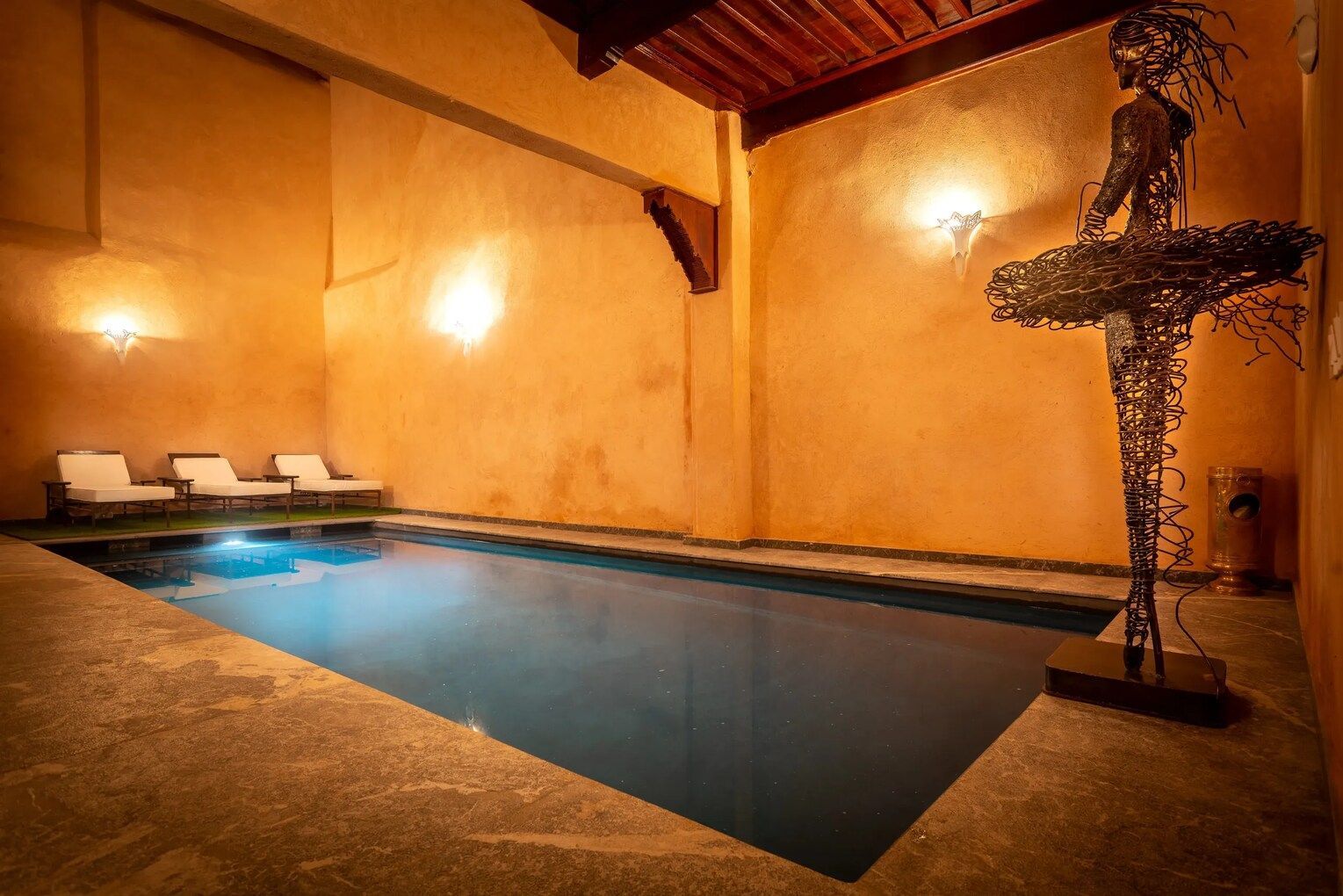 There is a large swimming pool in the middle of the room.
