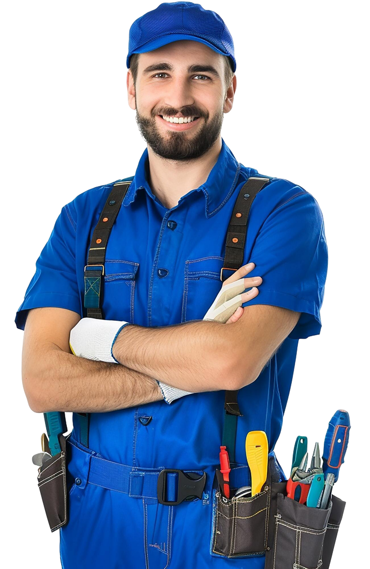 Smiling worker in blue overalls, arms crossed, with tools in belt pouches.