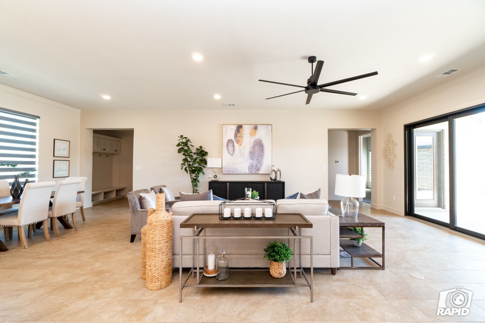 A living room with furniture and a ceiling fan