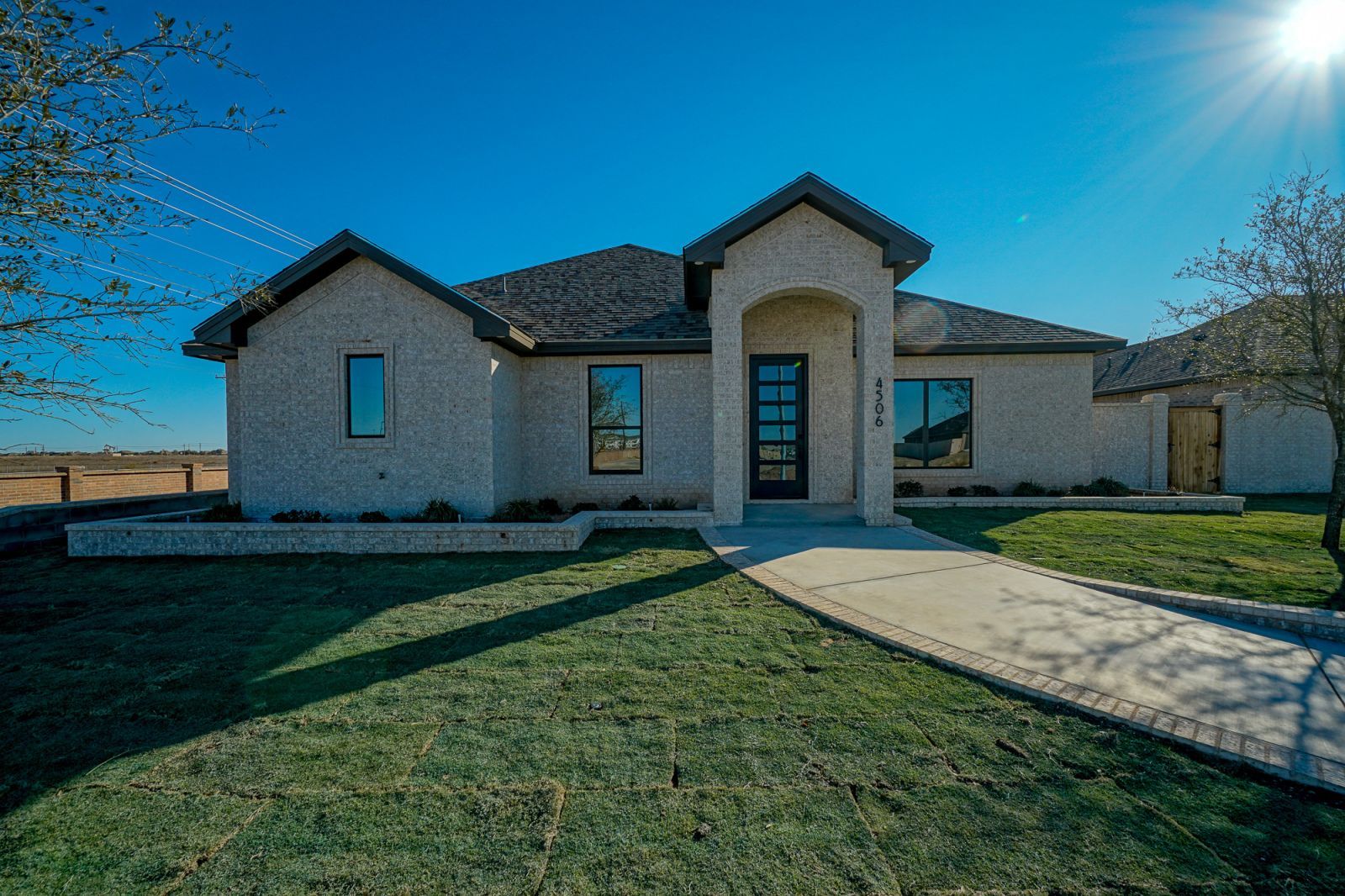 The front of a house with a walkway leading to it