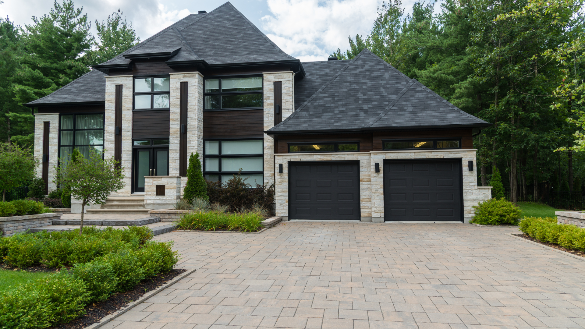A kitchen with gray cabinets and a large island