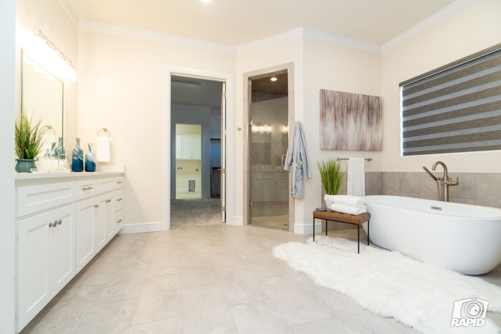 A bathroom with a bathtub and a walk in shower