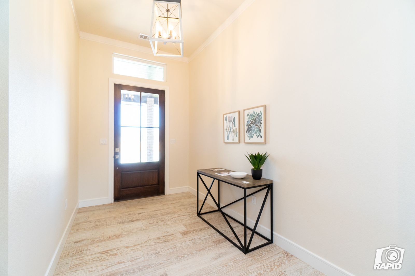 A hallway with a table in the middle of it