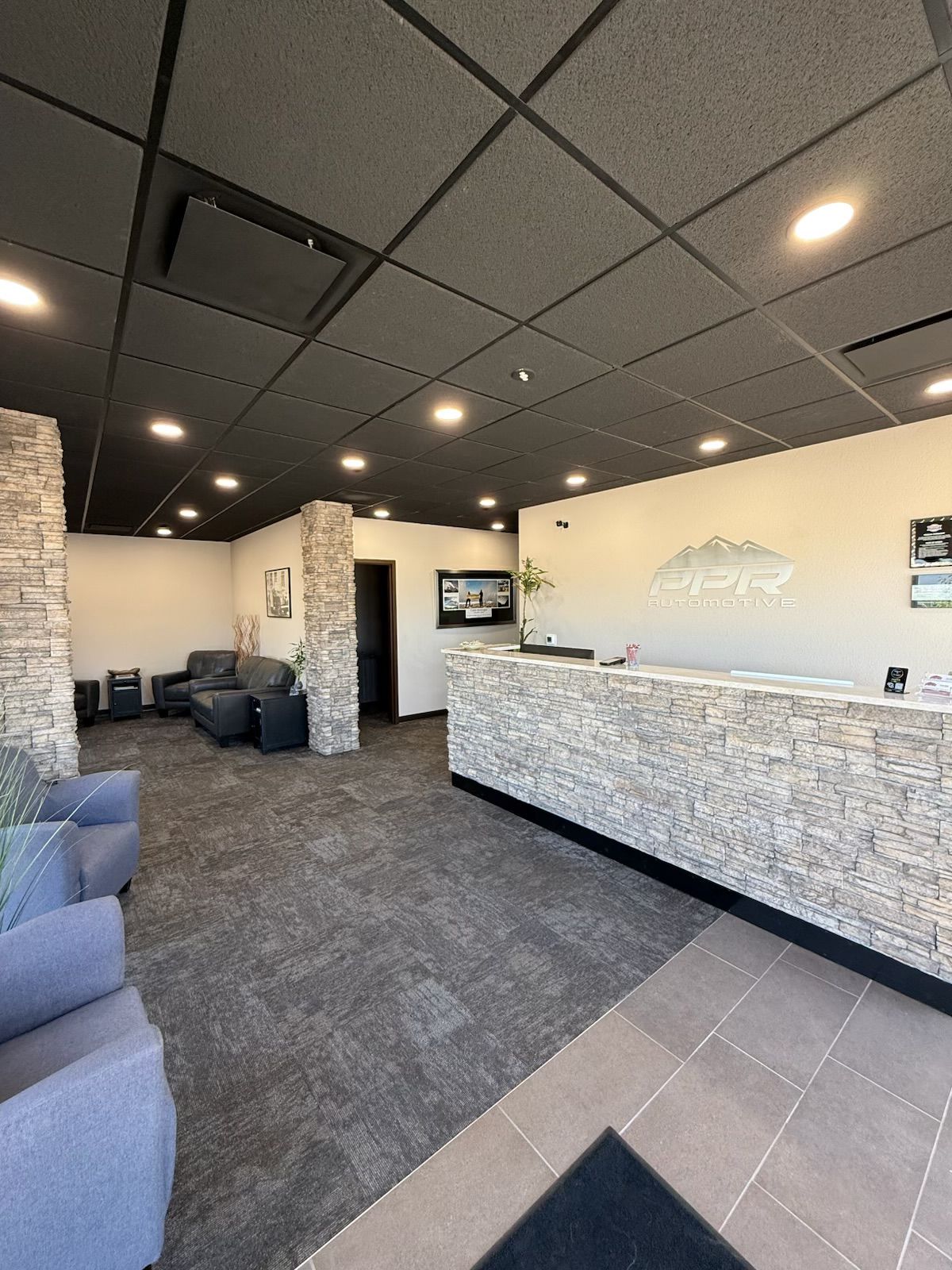 Reception area with stone accents | PPR Automotive