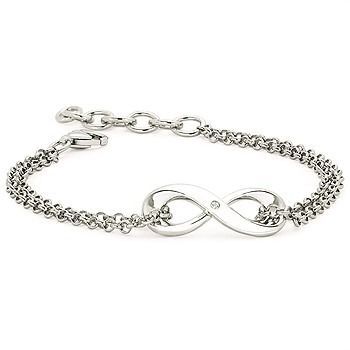 A silver bangle with a gold heart shaped charm