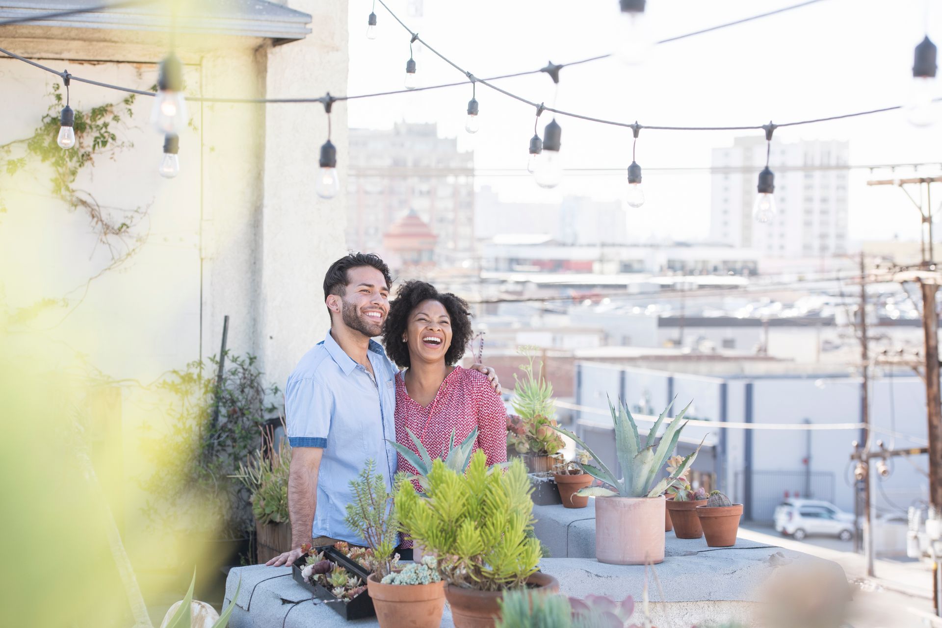 A family is standing in front of a door in a hallway.