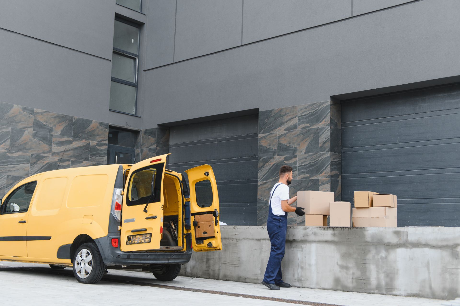A family is sitting on the porch of their house next to a swimming pool.