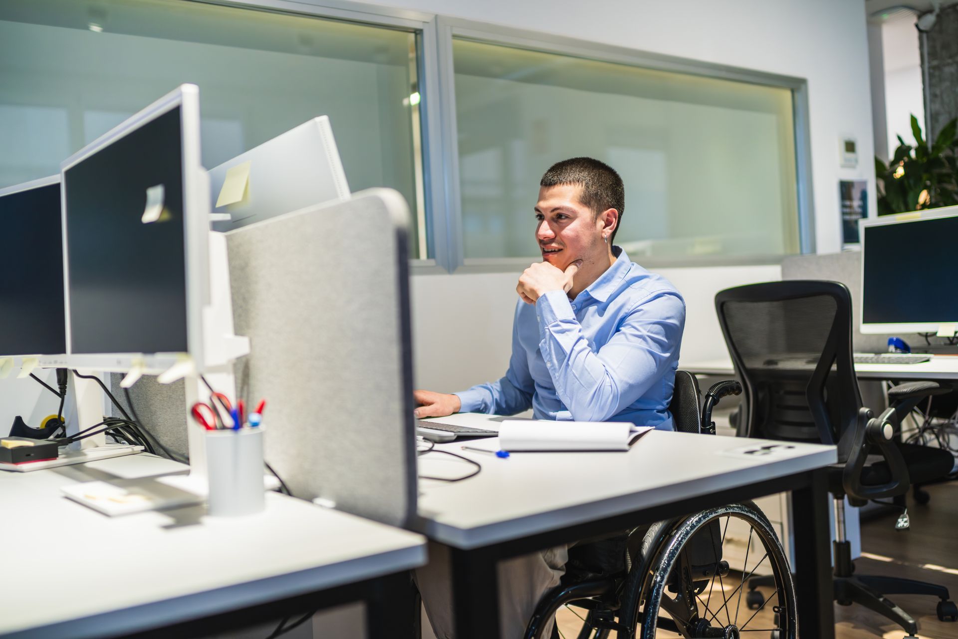 A family is standing in front of a door in a hallway.