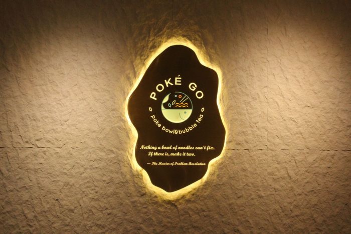 Poke Go Jax's logo sing on the wall