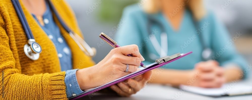 Person writing on a clipboard with a pen, a stethoscope around their neck, with another person in the background.