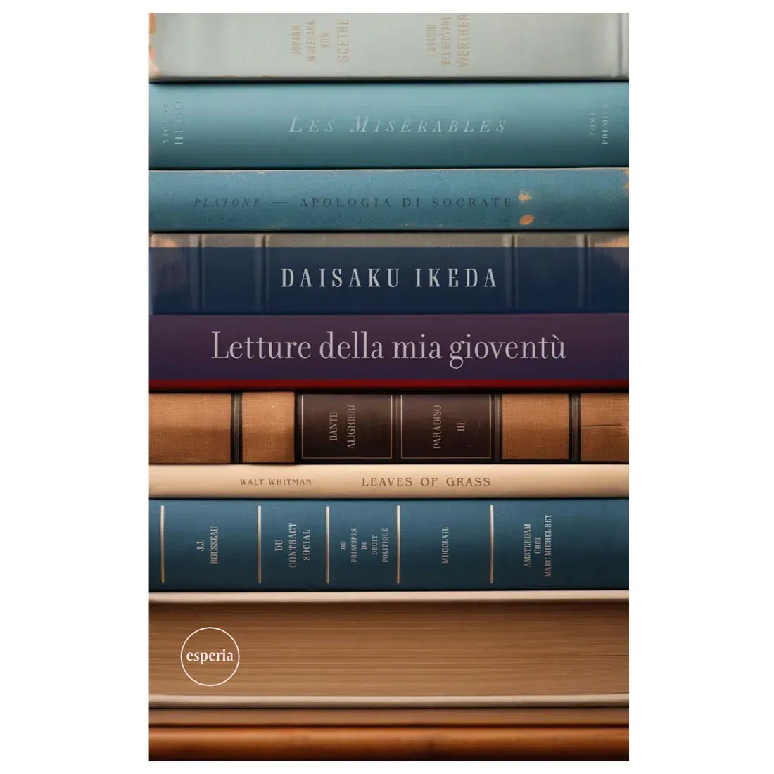 Stacked books with varied colors and titles. Book spines include author Daisaku Ikeda.