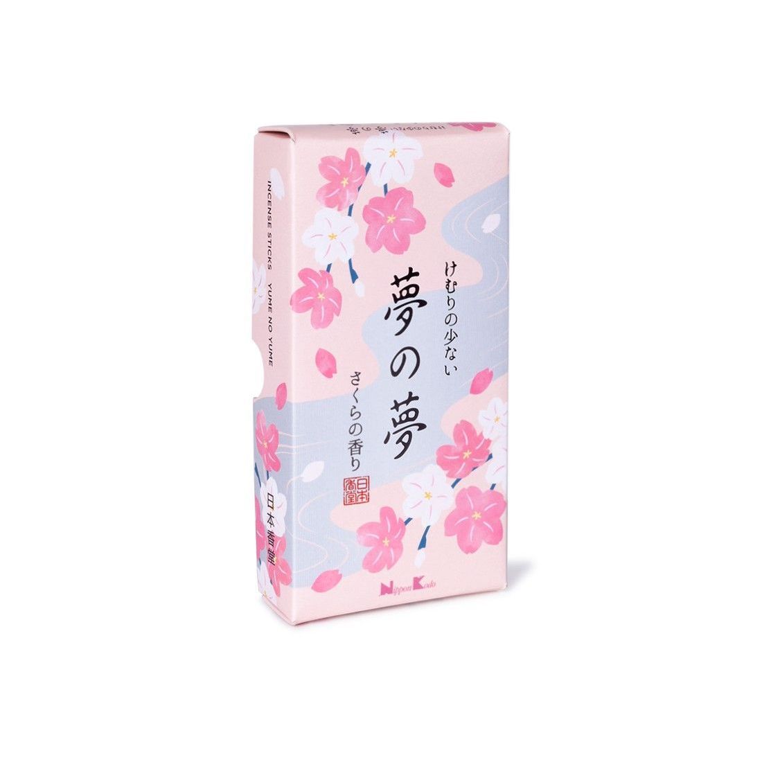 Una scatola di incenso con fiori rosa e bianchi sopra.