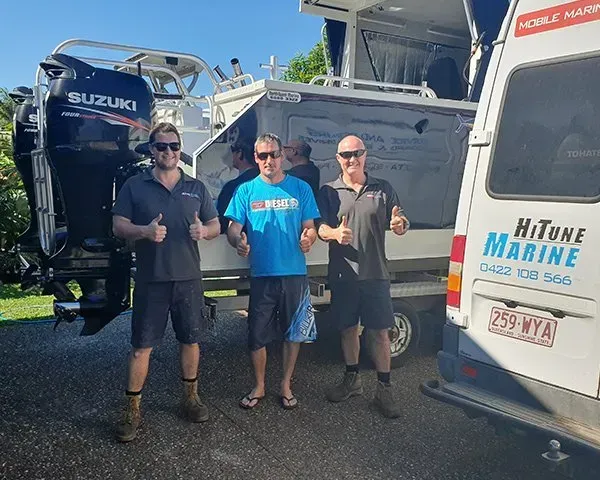 Three Men Give Thumbs up Next to A Boat with A Suzuki Engine and A Van — HiTune Marine In Innisfail, QLD  