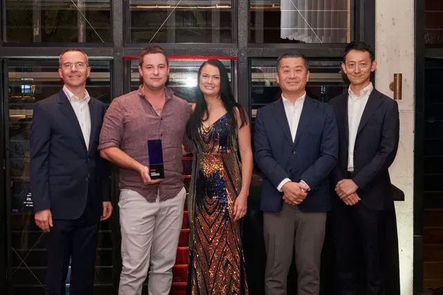 Five People Posing, Holding an Award — HiTune Marine In Bentley Park, QLD 
