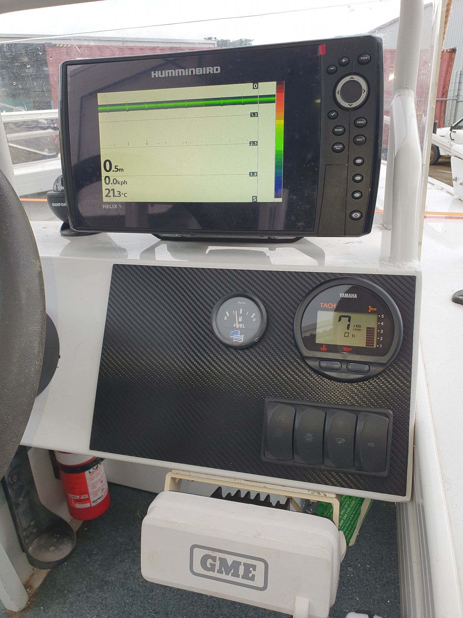 Boat Dashboard with Sonar Screen, Gauges, Switches, and A Gme Box — HiTune Marine In Mossman, QLD 