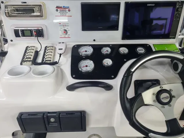 Boat Dashboard with Gauges, Displays, Steering Wheel, and Controls — HiTune Marine In Bentley Park, QLD 