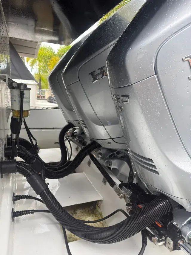 Three Silver Honda Outboard Boat Motors Mounted on A White Boat — HiTune Marine In Bentley Park, QLD 