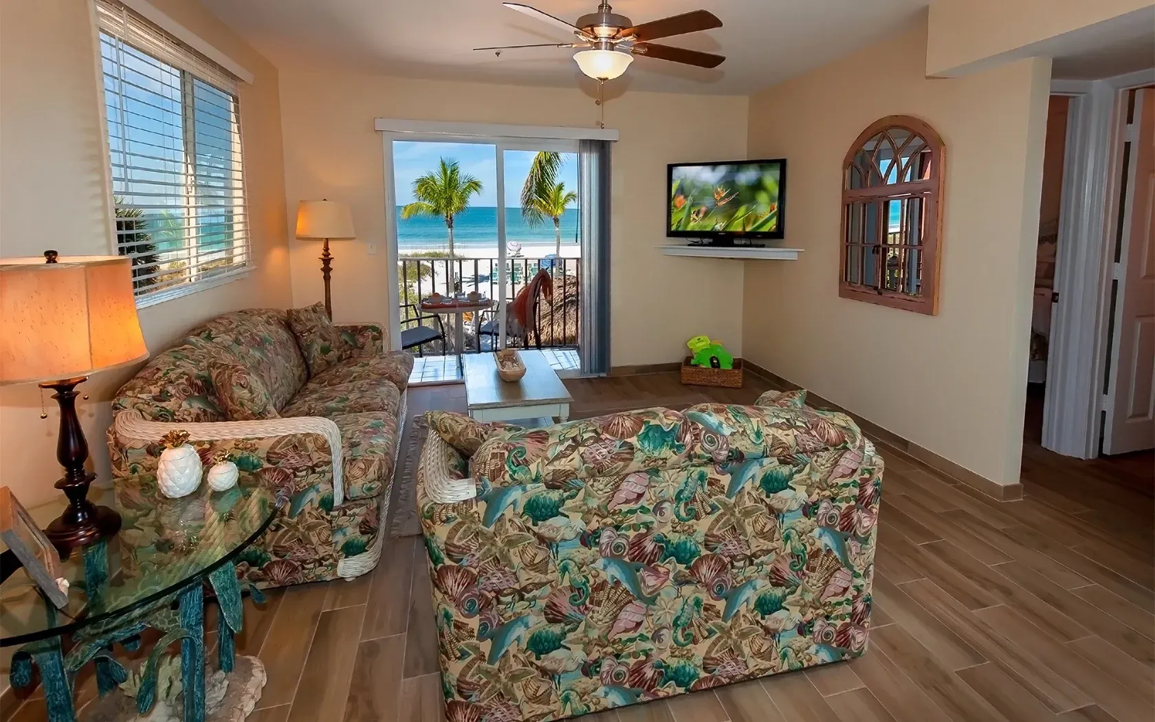 A living room with a couch and a flat screen tv