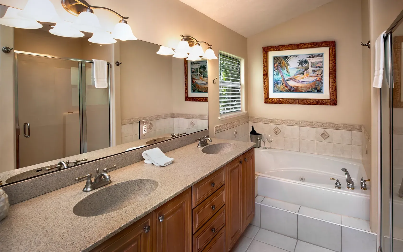 A bathroom with two sinks and a bathtub