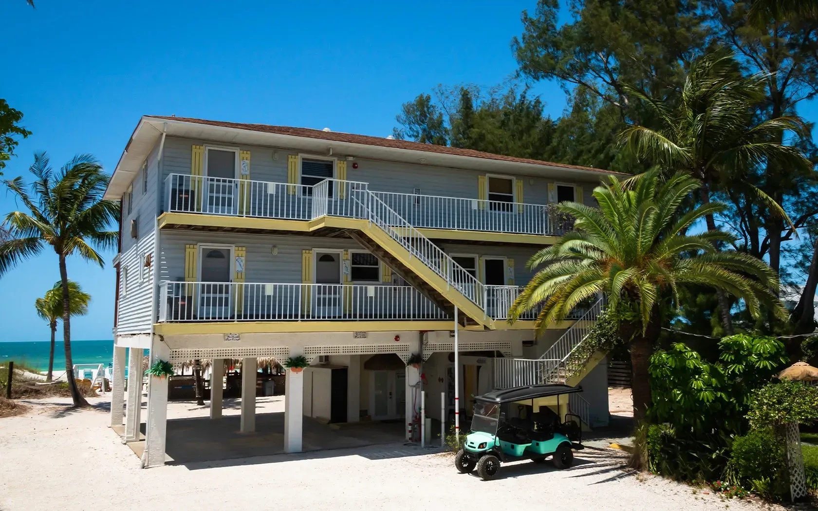 A house with a golf cart parked in front of it