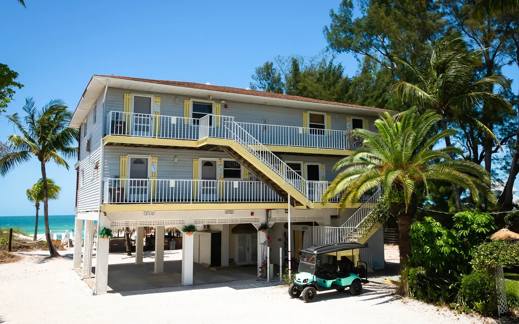 A house with a golf cart parked in front of it