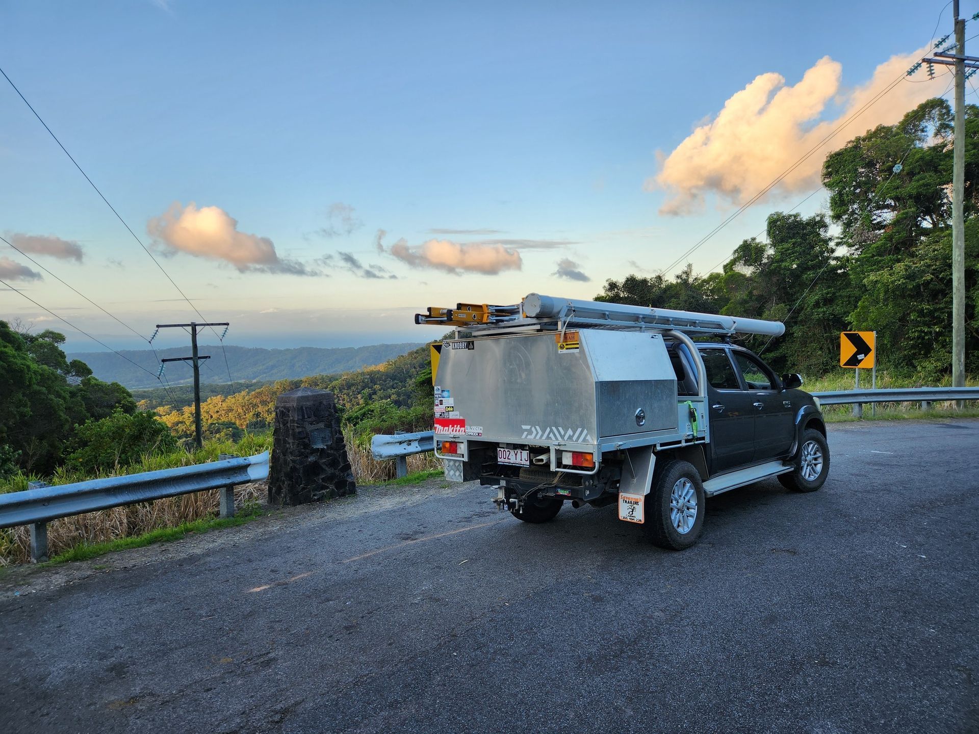A Person Is Installing A Light Switch On A Wall — Big Bang Electrical And Air In Trinity Park, QLD