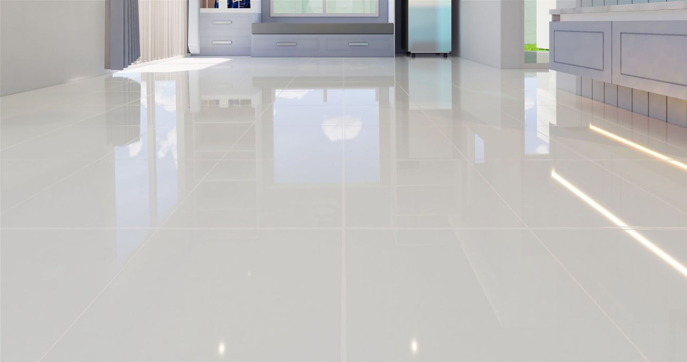 A white tiled floor in a living room with a reflection of a window.