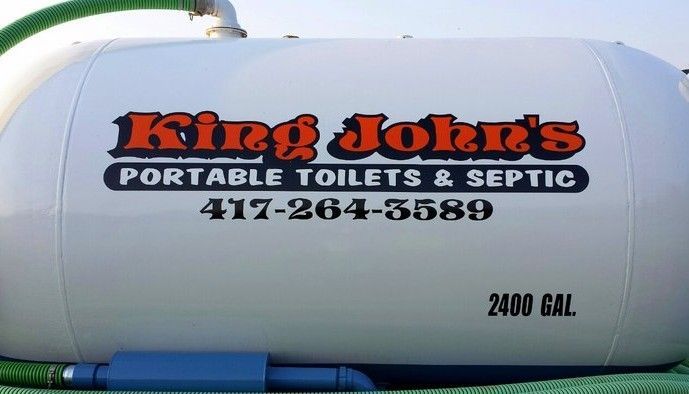A white portable septic tank with the text