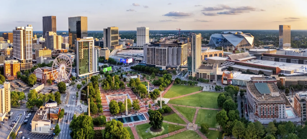 An aerial view of a city with a lot of buildings and trees.