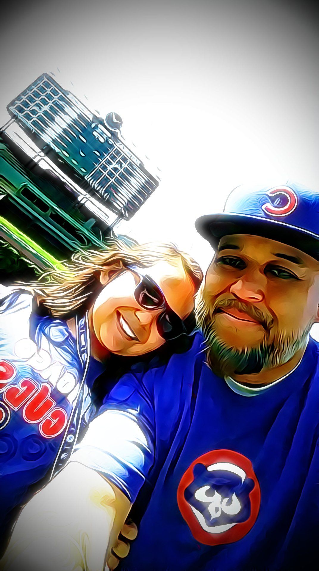 A man and a woman are posing for a picture while wearing cubs shirts.