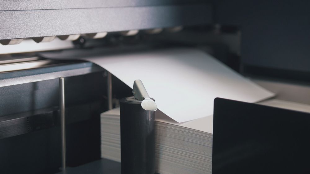 Printing Press Machine Takes Sheet Of Paper In Action — Carbon Copy Digital in Port Macquarie, NSW