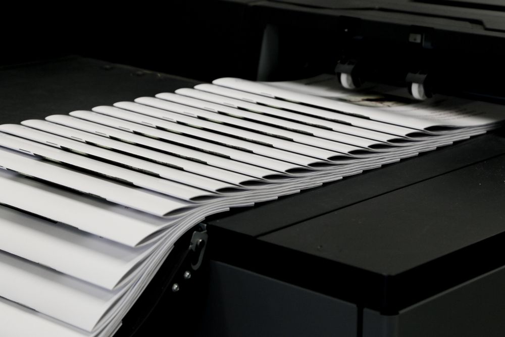 Close Up View Of Printed Magazines On Moving Conveyor — Carbon Copy Digital in Port Macquarie, NSW