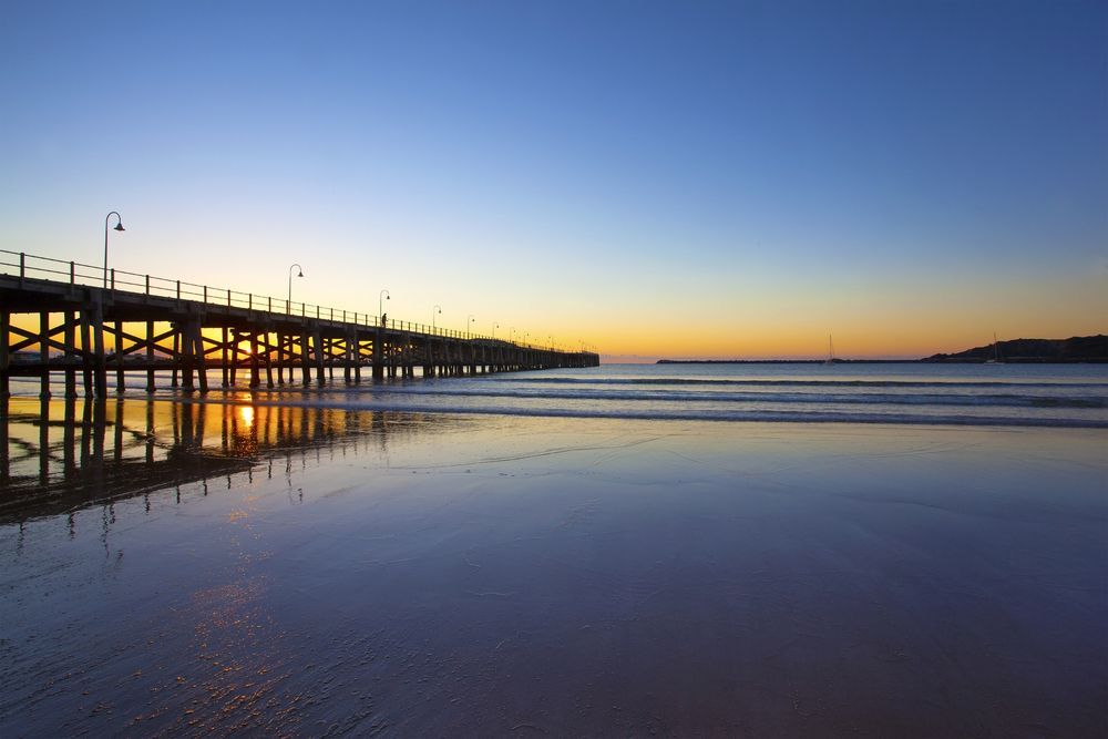 Pier Over Calm Water At Dusk — Carbon Copy Digital in Coffs Harbour, NSW