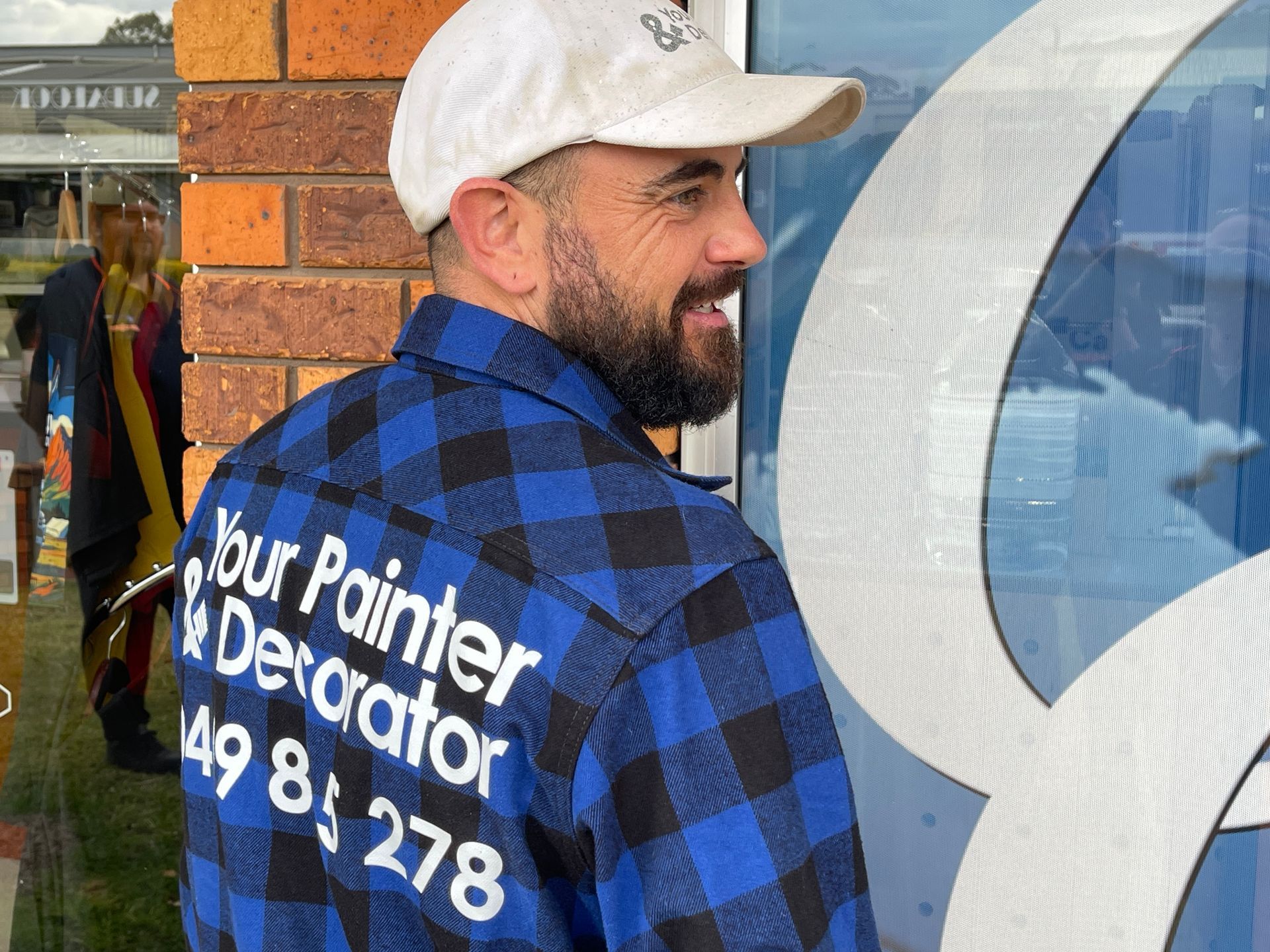 Man in blue plaid shirt with 