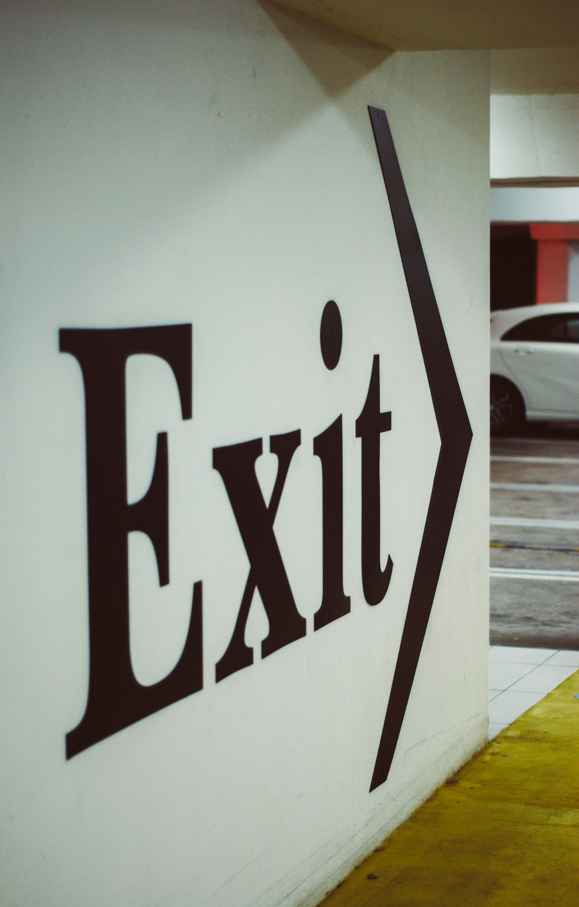 Black Large Exit Text On Wall With Arrow Sign — Carbon Copy Digital in Port Macquarie, NSW