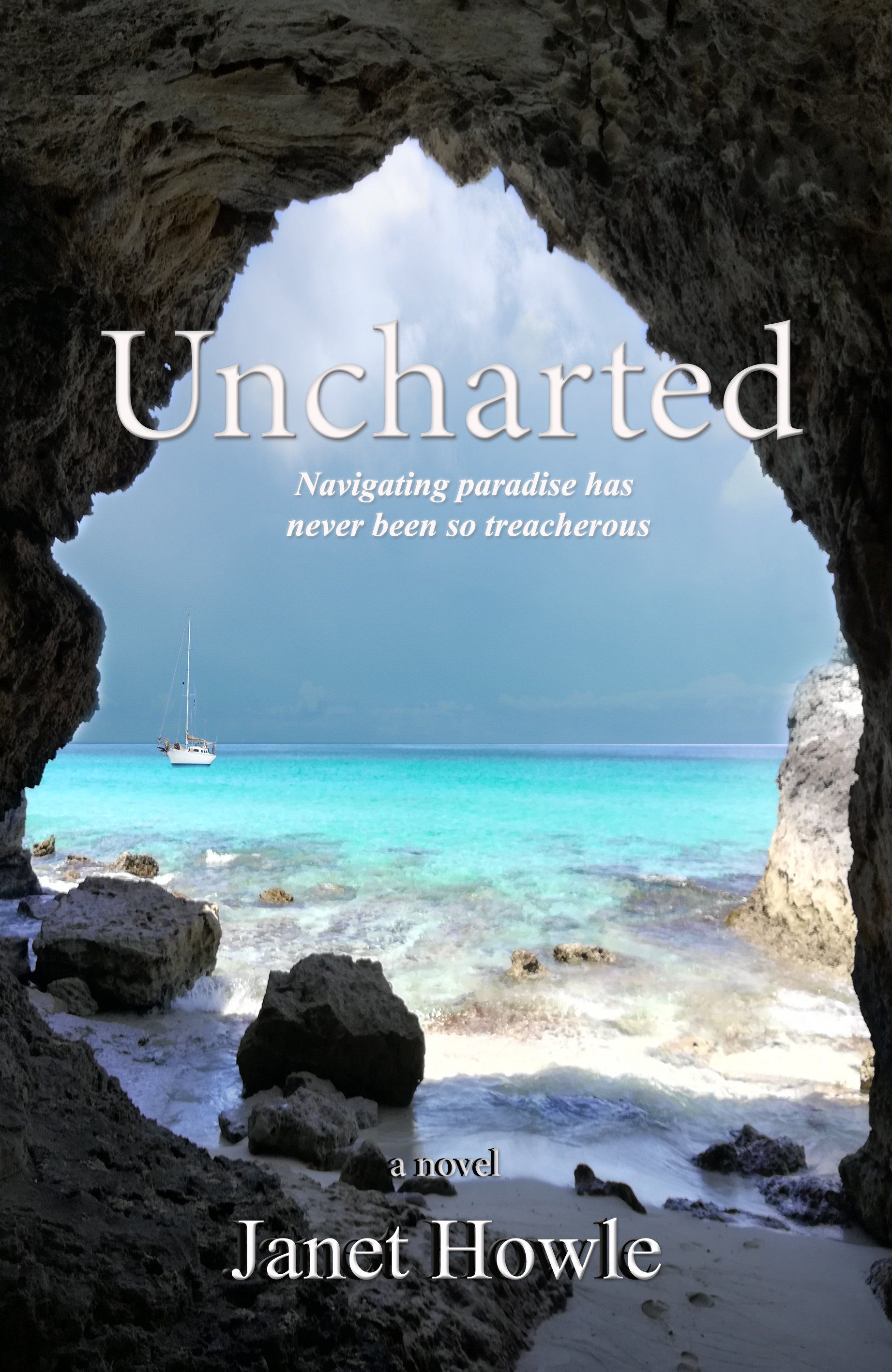 The cover of the book unchartered by janet howle about a murder mystery set at sea shows a view of the ocean through a cave.