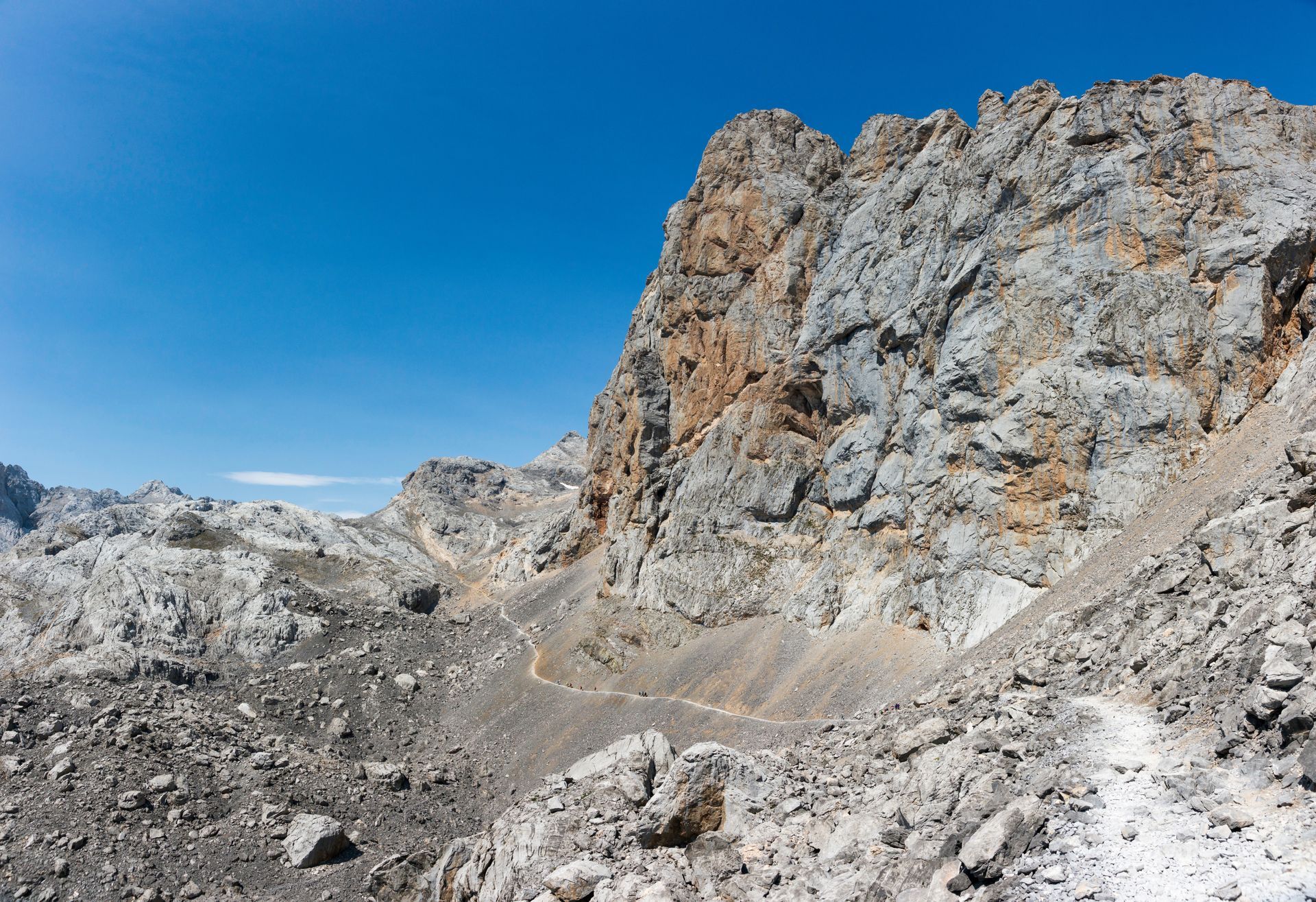 A mountain covered in rocks with a path going through it