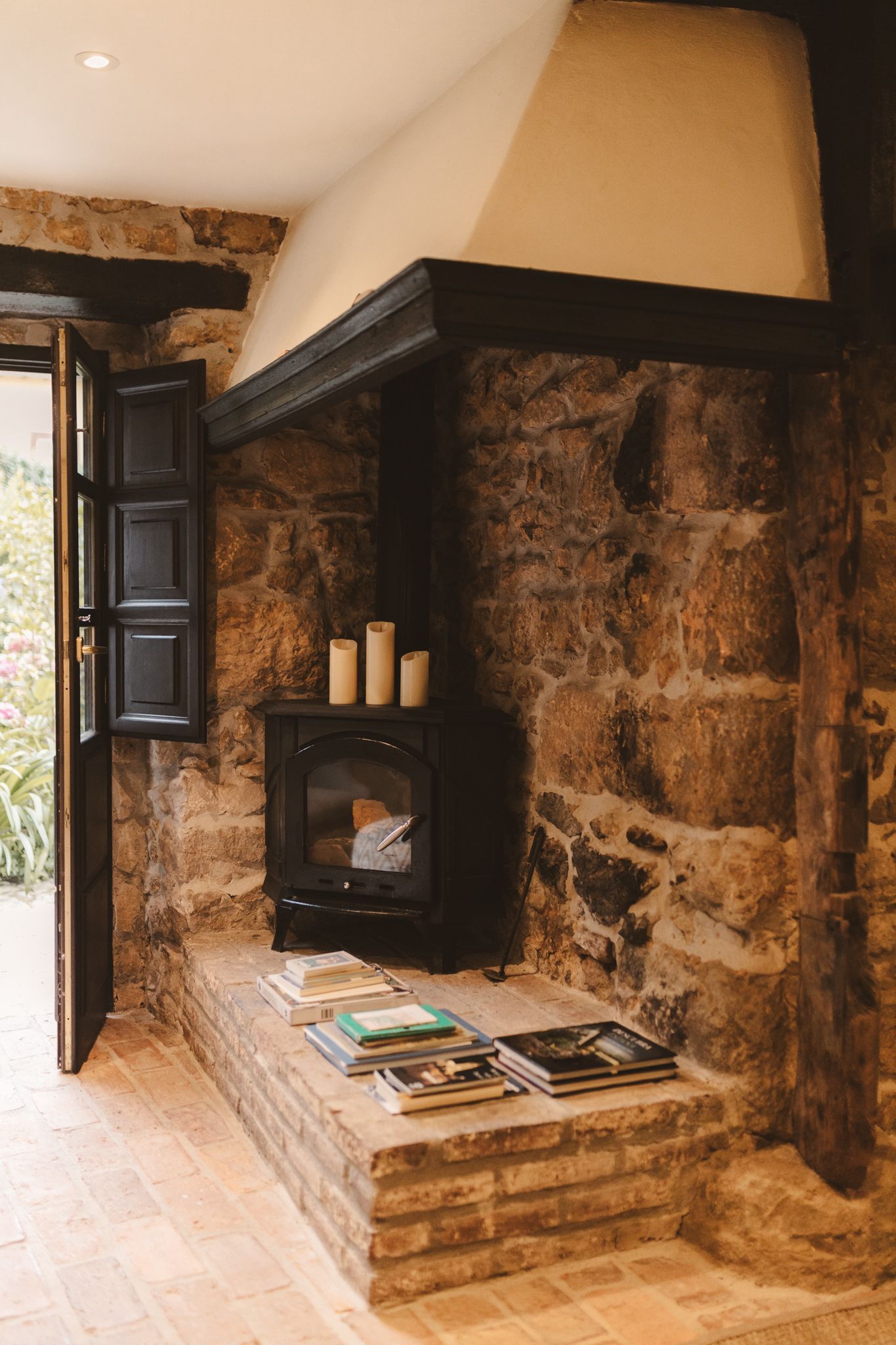 There is a fireplace in the middle of the room.