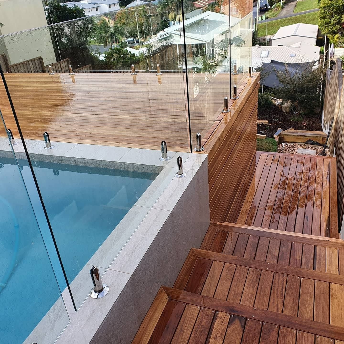 Timber Decking Around Swimming Pool — Red Dog Landscaping in Gold Coast, NSW