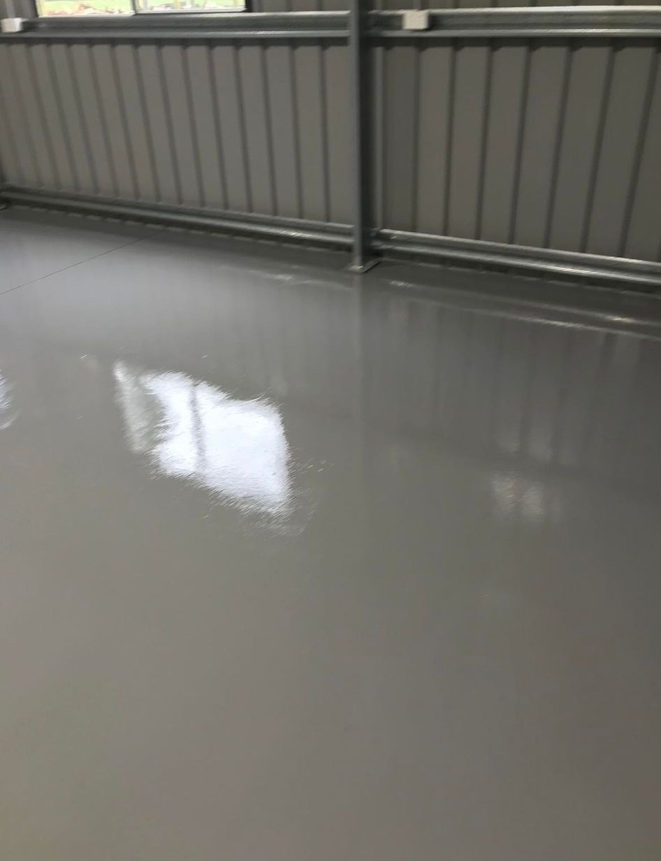 A close up of a gray concrete floor in a building