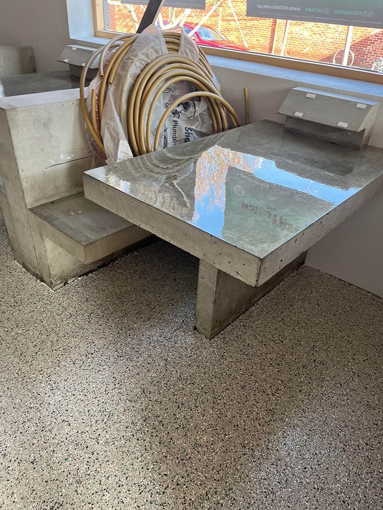 A table with a hose on top of it in a room next to a window