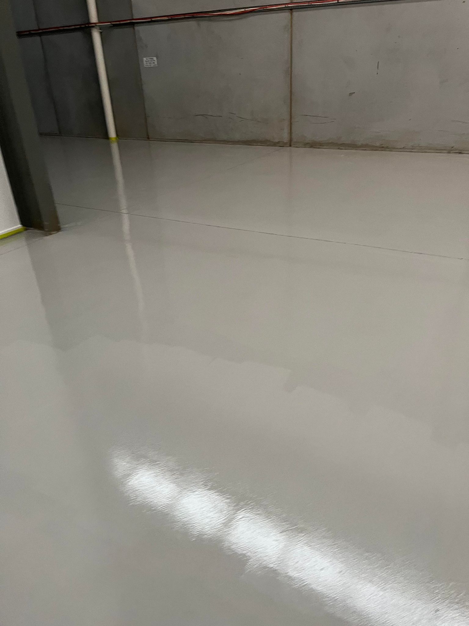A close up of a shiny white floor in a room